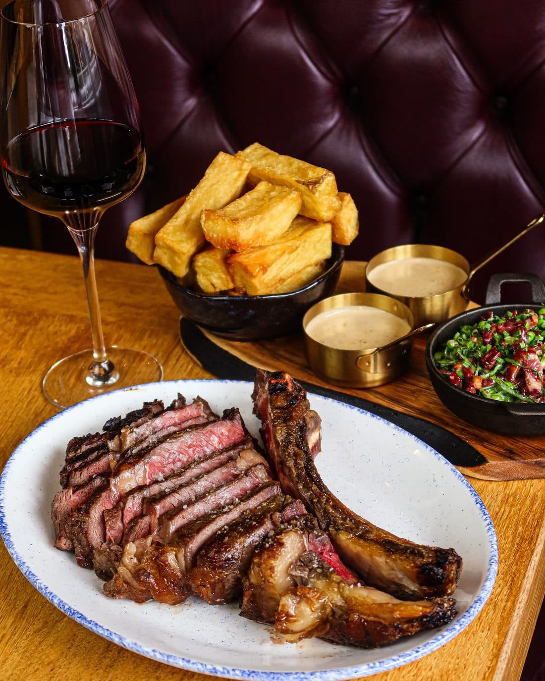 36oz Welsh côte de bœuf, carved, with wagyu chips and red wine