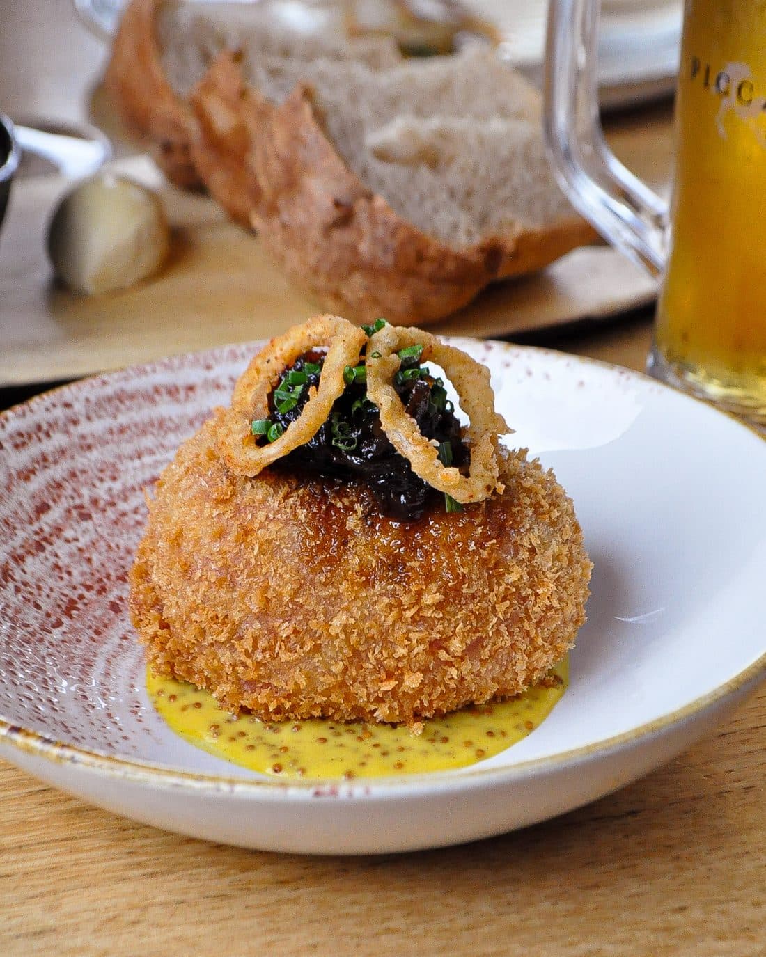 Ham hock scotch egg with crispy shallots