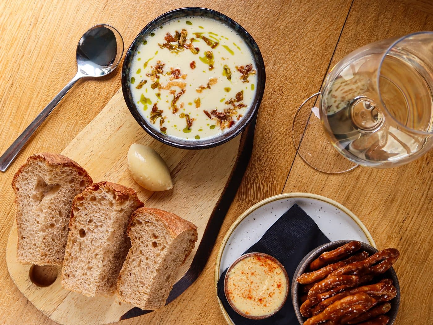 Onion soup with sourdough and a glass of white